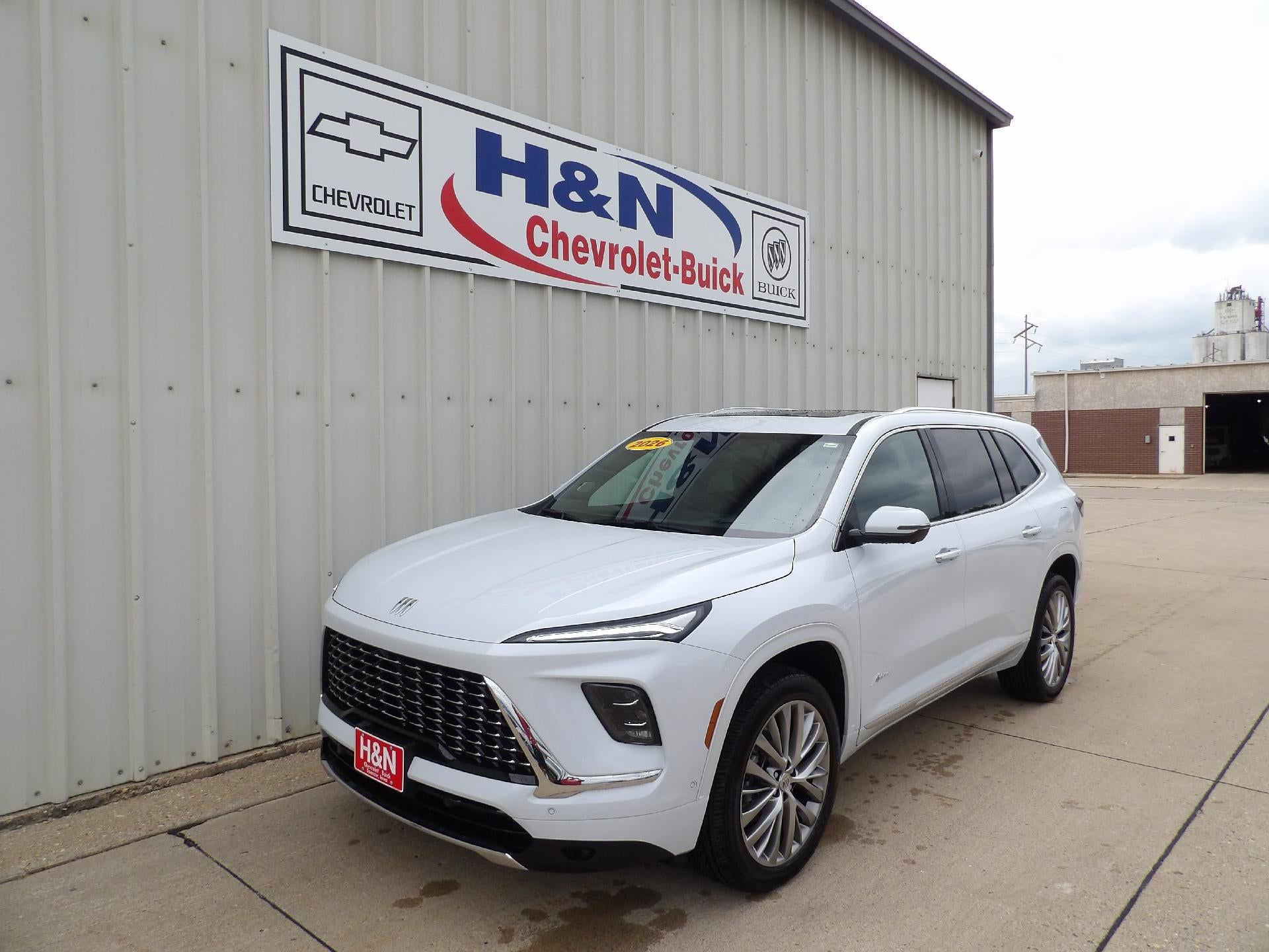 2026 Buick Enclave Avenir in Iridescent White Tricoat — front three-quarter view